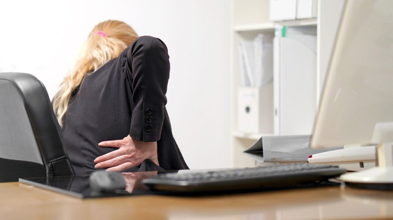 A woman worries about pain in the lumbar region